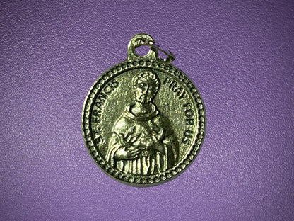 Medal with a religious figure on a purple background